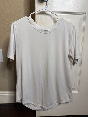 ZYIA White Performance Tee with Subtle Gray Logo